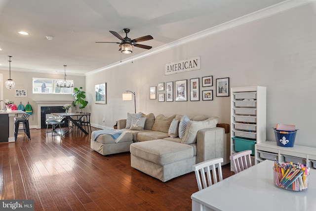 103 Norma Aly, Annapolis, MD 21403 - living area with ceiling fan, dark wood-type flooring, ornamental molding, a chandelier, and recessed lighting