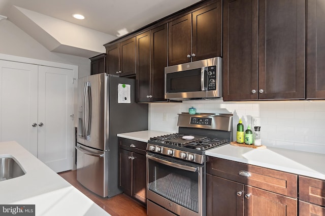 103 Norma Aly, Annapolis, MD 21403 - kitchen featuring appliances with stainless steel finishes, light countertops, backsplash, dark brown cabinets, and wood finished floors