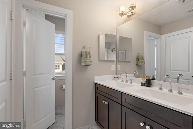 103 Norma Aly, Annapolis, MD 21403 - bathroom featuring marble look tiles and double vanity