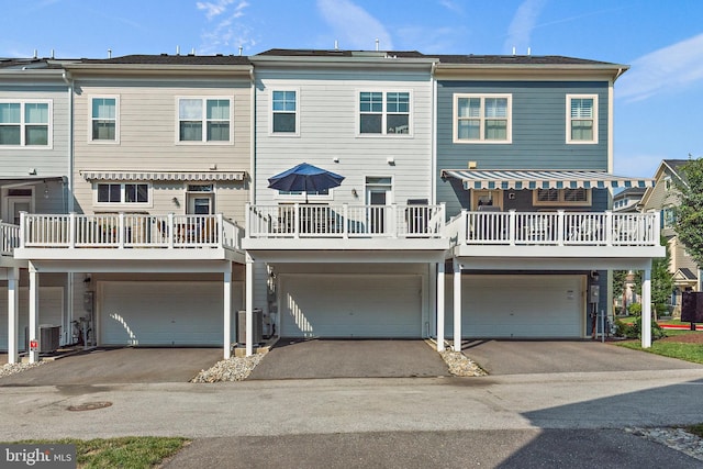 103 Norma Aly, Annapolis, MD 21403 - back of house featuring an attached garage, driveway, and a balcony
