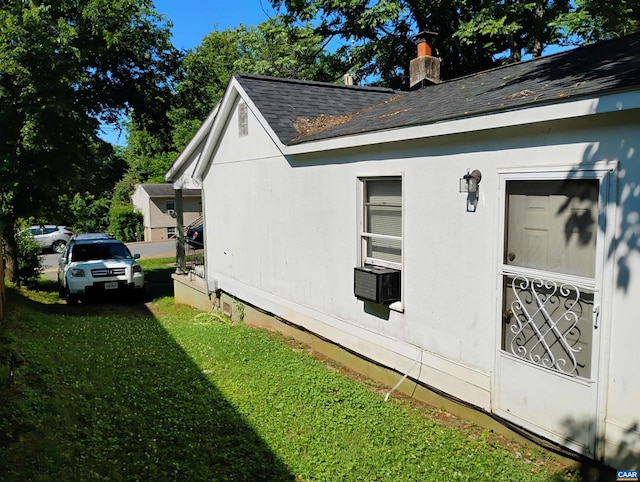 1411 Vine St, Charlottesville, VA 22902 - view of property exterior featuring a shingled roof, a yard, and a chimney