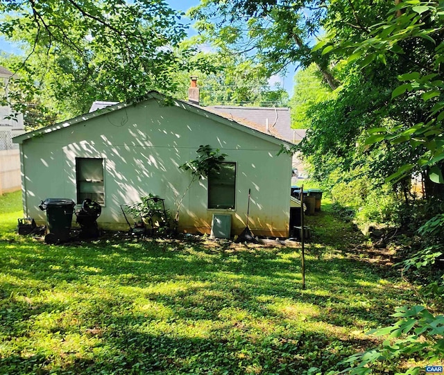 1411 Vine St, Charlottesville, VA 22902 - rear view of property with a yard and a chimney