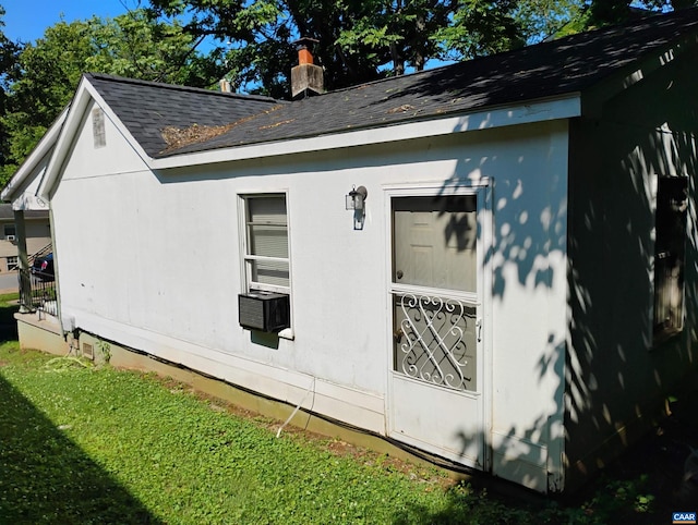 1411 Vine St, Charlottesville, VA 22902 - view of home's exterior with roof with shingles, a chimney, and a yard