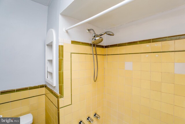 7152 N 20th St, Philadelphia, PA 19138 - bathroom with bathtub / shower combination, a wainscoted wall, and tile walls