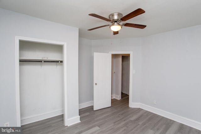 7152 N 20th St, Philadelphia, PA 19138 - unfurnished bedroom featuring wood finished floors, a ceiling fan, and a closet