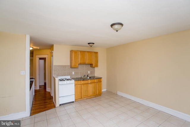7152 N 20th St, Philadelphia, PA 19138 - kitchen featuring white range with gas stovetop and backsplash
