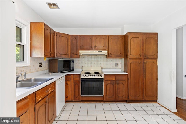 1605 N Amelia St, Sterling, VA 20164 - kitchen with electric stove, black microwave, dishwasher, under cabinet range hood, and light countertops