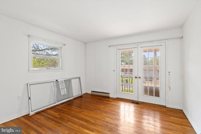 1605 N Amelia St, Sterling, VA 20164 - spare room featuring plenty of natural light, hardwood / wood-style floors, and french doors