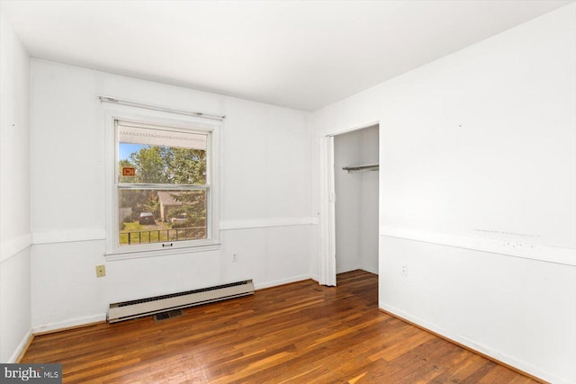 1605 N Amelia St, Sterling, VA 20164 - unfurnished bedroom featuring baseboard heating, wood finished floors, and a closet