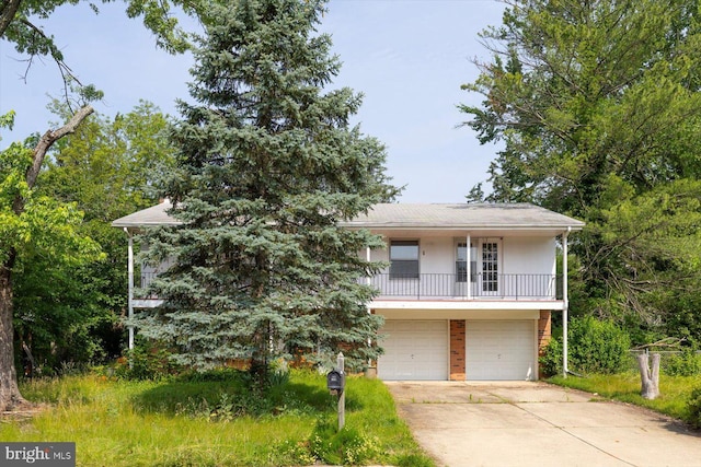 1605 N Amelia St, Sterling, VA 20164 - view of front of property featuring a garage, concrete driveway, and brick siding