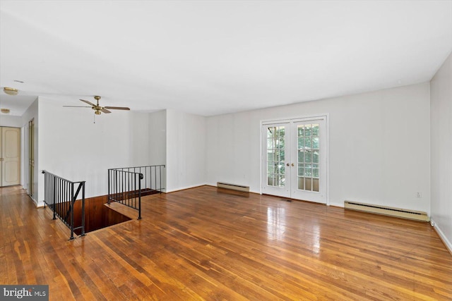 1605 N Amelia St, Sterling, VA 20164 - unfurnished room with baseboard heating, hardwood / wood-style flooring, a ceiling fan, and french doors