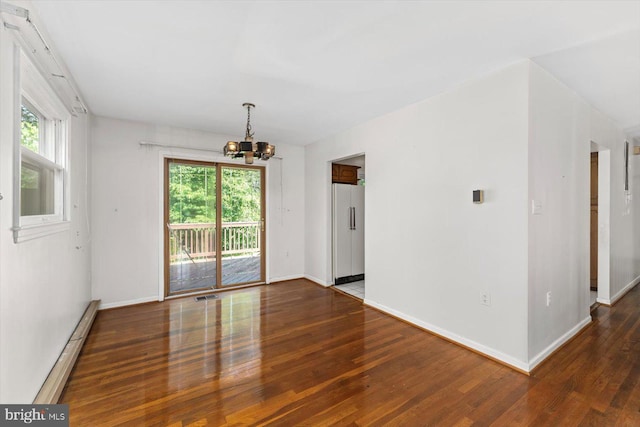1605 N Amelia St, Sterling, VA 20164 - unfurnished room with a chandelier, wood finished floors, plenty of natural light, and a baseboard radiator