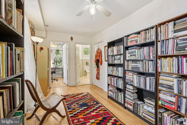 455 Krams Ave, Philadelphia, PA 19128 - sitting room featuring wood finished floors, a ceiling fan, and bookshelves