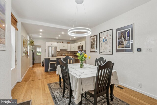 455 Krams Ave, Philadelphia, PA 19128 - dining room featuring a chandelier, light wood-style flooring, and recessed lighting