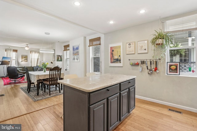455 Krams Ave, Philadelphia, PA 19128 - kitchen with light wood-type flooring, open floor plan, a center island, recessed lighting, and pendant lighting