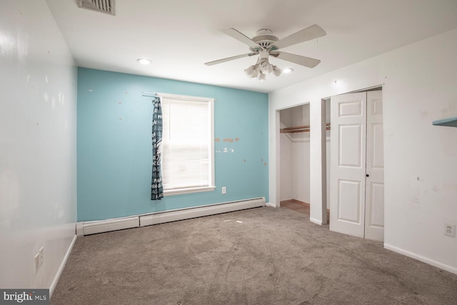 214 Crooked Ln, King Of Prussia, PA 19406 - unfurnished bedroom featuring a baseboard radiator, carpet flooring, two closets, a ceiling fan, and recessed lighting