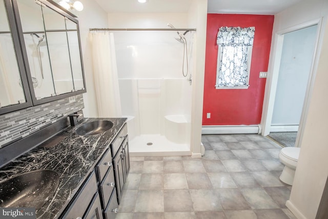 214 Crooked Ln, King Of Prussia, PA 19406 - full bath with baseboard heating, tasteful backsplash, double vanity, and a shower with curtain