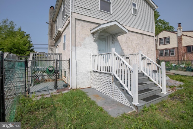 214 Crooked Ln, King Of Prussia, PA 19406 - view of side of home with a gate and stucco siding