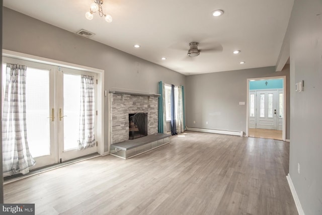 214 Crooked Ln, King Of Prussia, PA 19406 - unfurnished living room with a baseboard heating unit, a ceiling fan, plenty of natural light, french doors, and recessed lighting