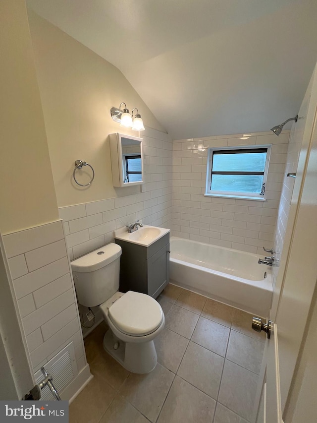 808 Division Ave NE, Washington, DC 20019 - full bathroom with tile walls, tile patterned flooring, lofted ceiling, vanity, and tub / shower combination