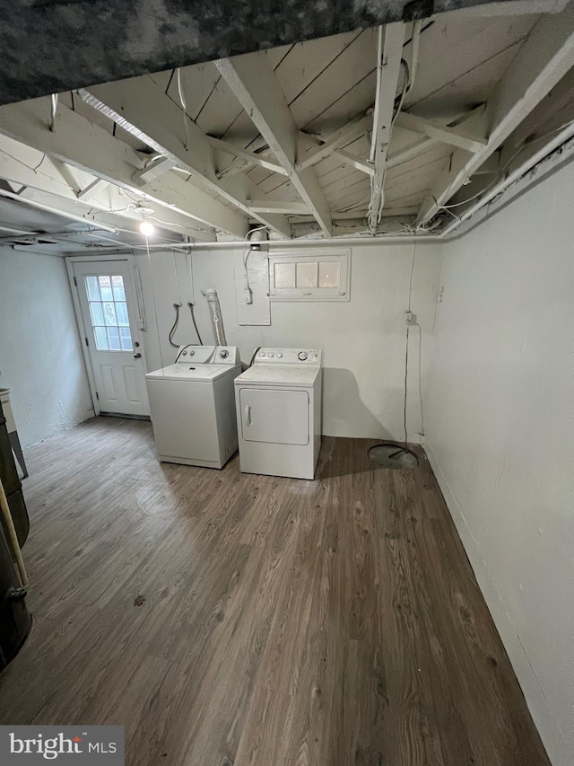 808 Division Ave NE, Washington, DC 20019 - laundry room featuring washing machine and clothes dryer and wood finished floors