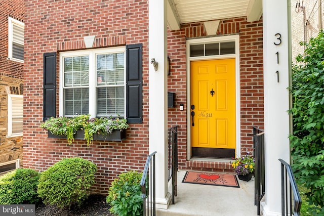 311 W 3rd Ave, Conshohocken, PA 19428 - doorway to property featuring brick siding