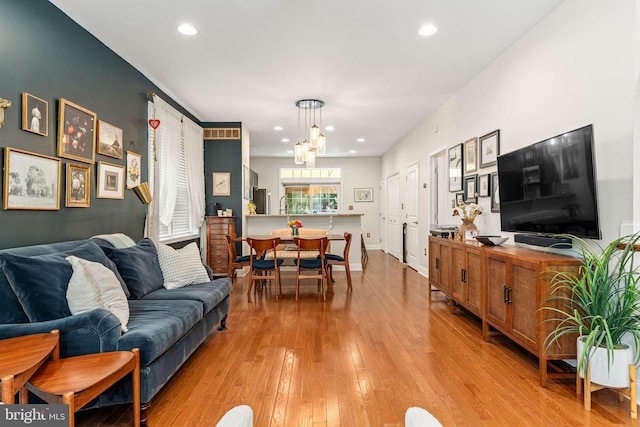 311 W 3rd Ave, Conshohocken, PA 19428 - living area with light wood-style floors, a chandelier, and recessed lighting