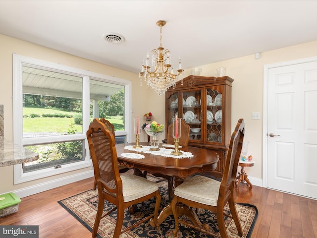 5409 Greenspring Valley Rd, Green Spring, WV 26722 - dining space with a chandelier and hardwood / wood-style floors