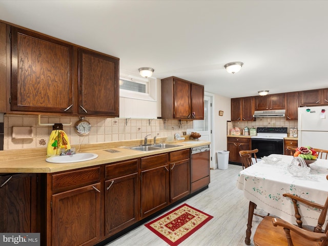 5409 Greenspring Valley Rd, Green Spring, WV 26722 - kitchen with range with electric stovetop, freestanding refrigerator, under cabinet range hood, dishwashing machine, and tasteful backsplash