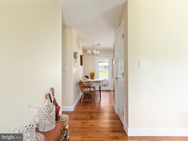 5409 Greenspring Valley Rd, Green Spring, WV 26722 - hall featuring a chandelier and light wood-style flooring