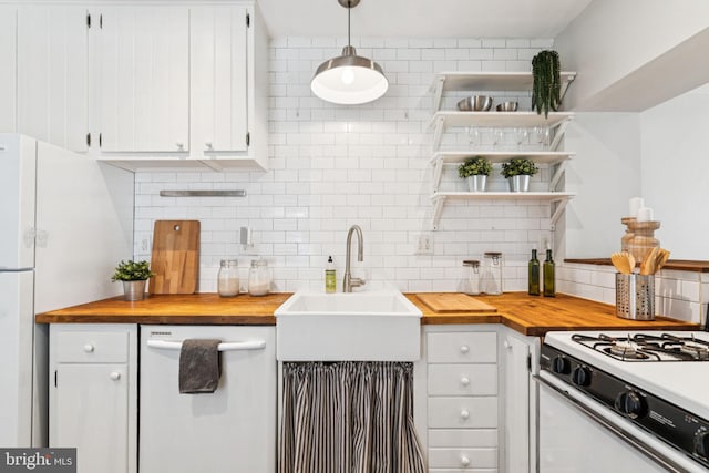 1918 E Albert St, Philadelphia, PA 19125 - kitchen featuring butcher block countertops, white appliances, decorative backsplash, and white cabinetry