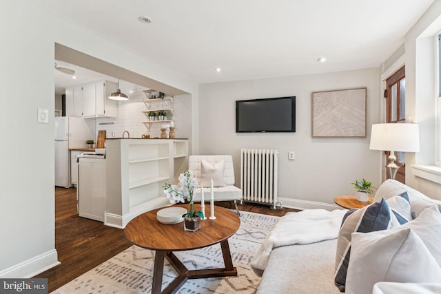 1918 E Albert St, Philadelphia, PA 19125 - living area with radiator heating unit, dark wood-style flooring, and recessed lighting