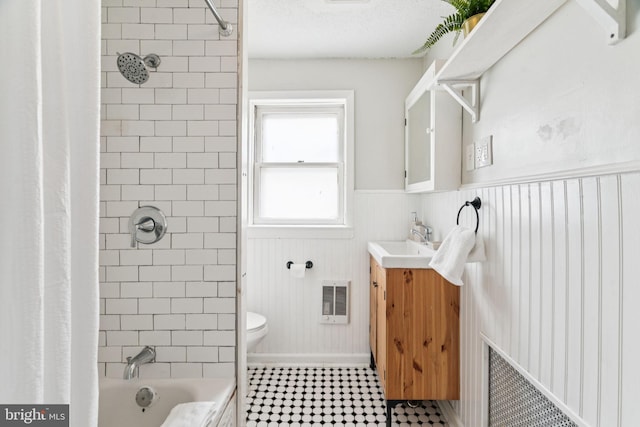 1918 E Albert St, Philadelphia, PA 19125 - bathroom with vanity, wainscoting, heating unit, and shower / tub combo with curtain