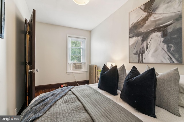 1918 E Albert St, Philadelphia, PA 19125 - bedroom with radiator heating unit, wood finished floors, and cooling unit