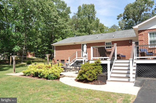 6197 Fishermans Way, Mechanicsville, VA 23116 - rear view of property featuring brick siding, stairway, a yard, a deck, and a patio