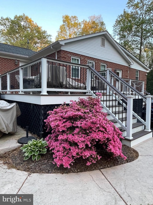 6197 Fishermans Way, Mechanicsville, VA 23116 - view of side of home with brick siding, a deck, and stairs