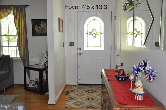 6197 Fishermans Way, Mechanicsville, VA 23116 - foyer with plenty of natural light and wood finished floors