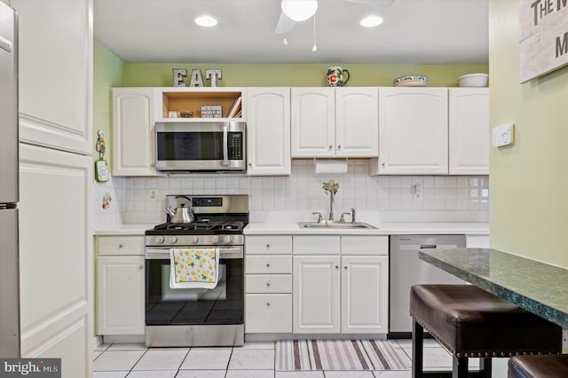 15 Paul Rd, Maple Shade, NJ 08052 - kitchen with stainless steel appliances, white cabinets, backsplash, light tile patterned flooring, and recessed lighting