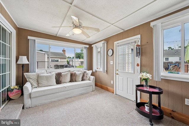 15 Paul Rd, Maple Shade, NJ 08052 - living area featuring healthy amount of natural light, carpet floors, wood walls, and a ceiling fan