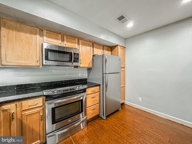 3801 Ridge Knoll Ct Unit 206A, Fairfax, VA 22033 - kitchen featuring stainless steel appliances, dark wood finished floors, recessed lighting, and dark stone counters