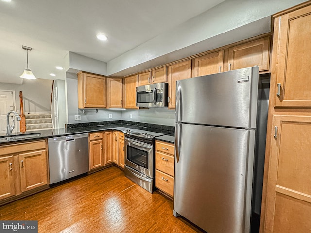 3801 Ridge Knoll Ct Unit 206A, Fairfax, VA 22033 - kitchen featuring appliances with stainless steel finishes, recessed lighting, hanging light fixtures, dark wood-style floors, and brown cabinetry