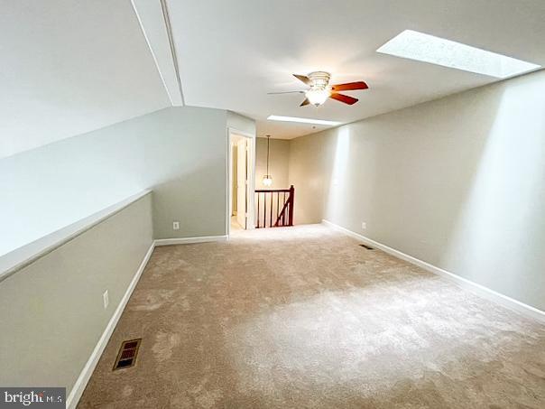 3801 Ridge Knoll Ct Unit 206A, Fairfax, VA 22033 - additional living space with a skylight, a ceiling fan, and carpet