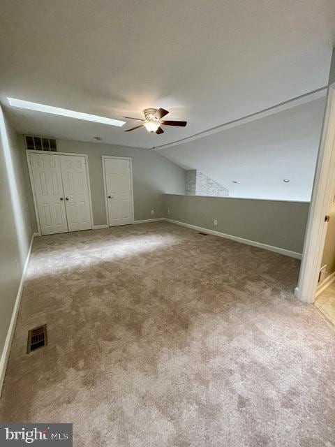 3801 Ridge Knoll Ct Unit 206A, Fairfax, VA 22033 - unfurnished bedroom with carpet, lofted ceiling, and ceiling fan