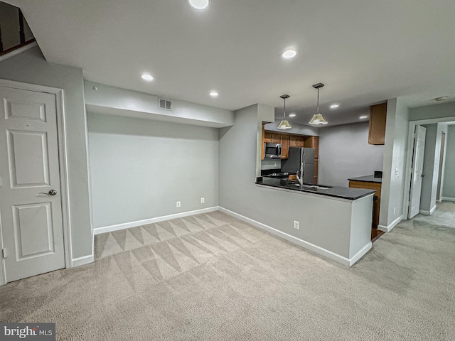 3801 Ridge Knoll Ct Unit 206A, Fairfax, VA 22033 - kitchen featuring stainless steel appliances, light colored carpet, dark countertops, recessed lighting, and brown cabinetry