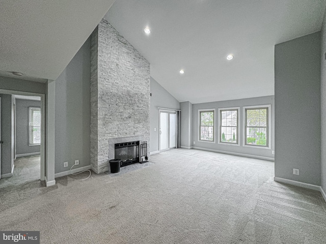 3801 Ridge Knoll Ct Unit 206A, Fairfax, VA 22033 - unfurnished living room with carpet, a stone fireplace, high vaulted ceiling, and recessed lighting