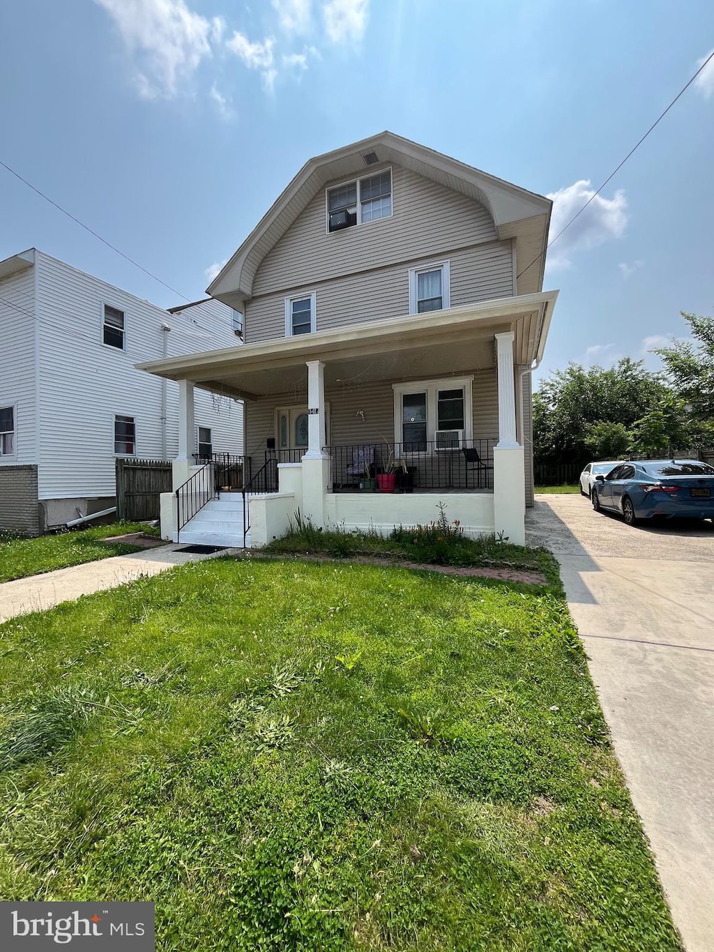4412 Westfield Ave, Pennsauken, NJ 08110 - american foursquare style home featuring a porch and a front lawn