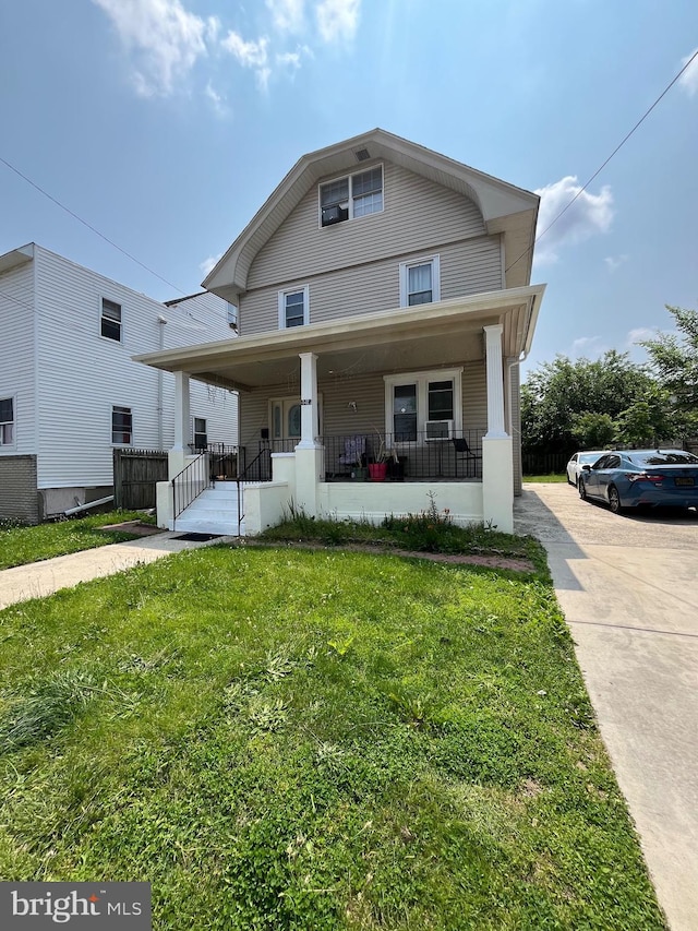 4412 Westfield Ave, Pennsauken, NJ 08110 - american foursquare style home featuring a porch and a front lawn