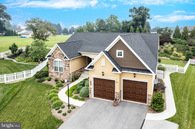4136 Shanelle Ct Lot 10, Hampstead, MD 21074 - craftsman-style house with stone siding, asphalt driveway, roof with shingles, and a fenced backyard