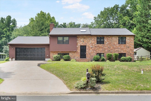 1215 Lorene Dr, Pasadena, MD 21122 - raised ranch with a chimney, concrete driveway, an attached garage, and brick siding