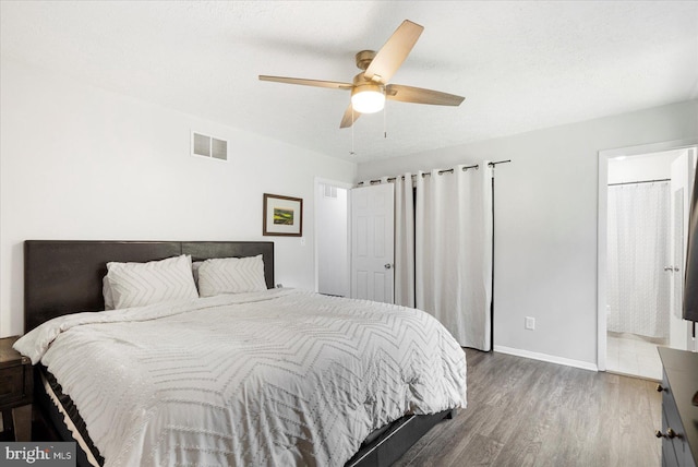 1215 Lorene Dr, Pasadena, MD 21122 - bedroom with wood finished floors, ceiling fan, and connected bathroom
